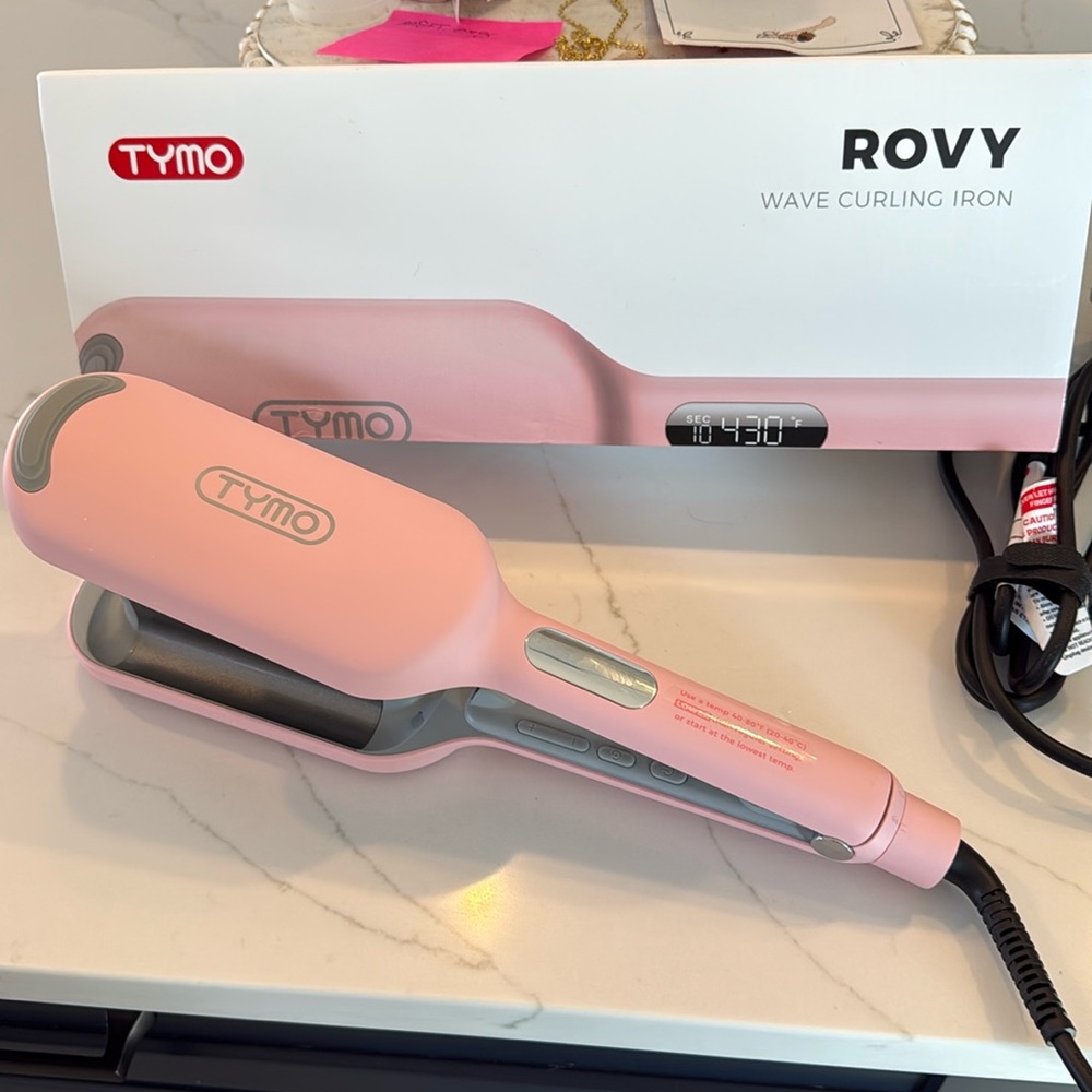 Brand new with box never used pink was curling iron but opened